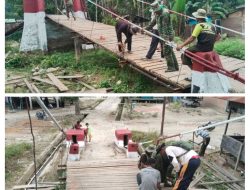 Kodim 0108/Aceh Tenggara Bersama Warga merapikan Lantai Jembatan Gantung di Kec. Ketambe, Aceh Tenggara.